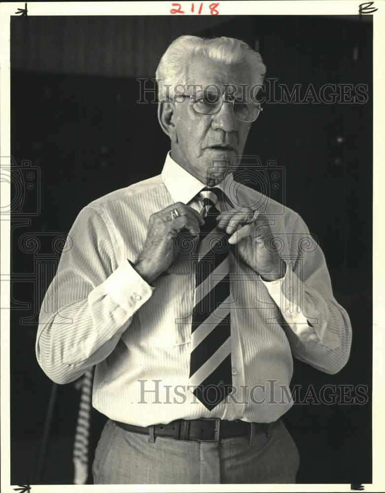 1983 Gus Champagne models a suit at St. Charles fashion show - Historic Images