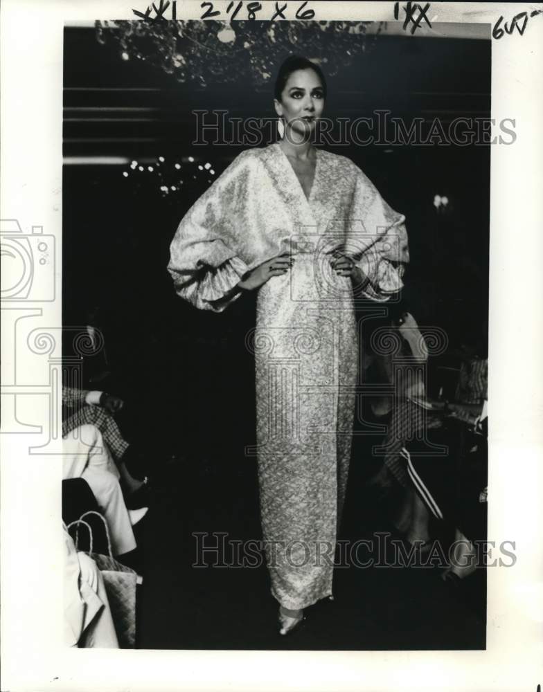 1978 A model wears silk slim wrap dress by George Stavropoulos - Historic Images