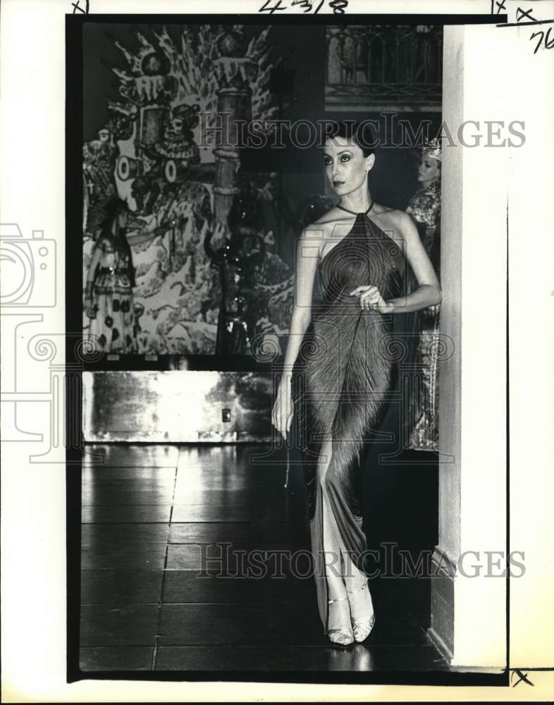 1979 A model in slinky halter-neck evening gown from Maison Blanche - Historic Images