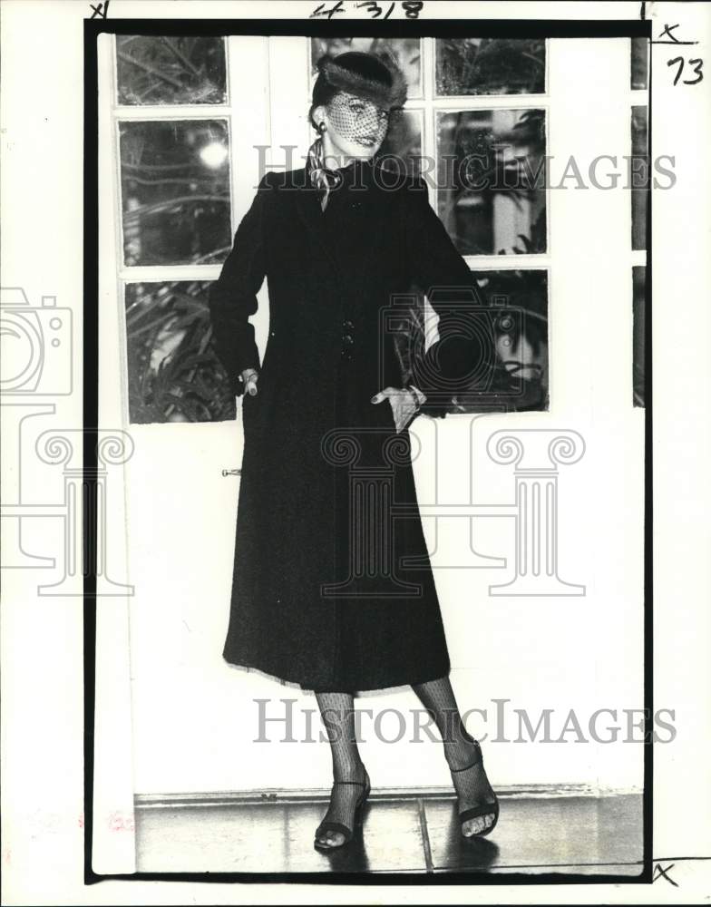 1979 A model wears side-buttoned coat in nubby wool from Godchaux&#39;s - Historic Images