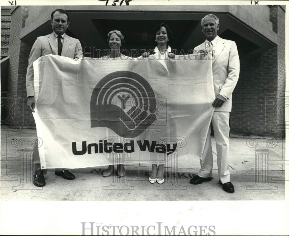 1984 Members hold the United Way&#39;s banner - Historic Images