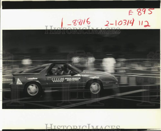 1989 Press Photo University of New Orleans -- Race car speeds by - noc87485- Historic Images