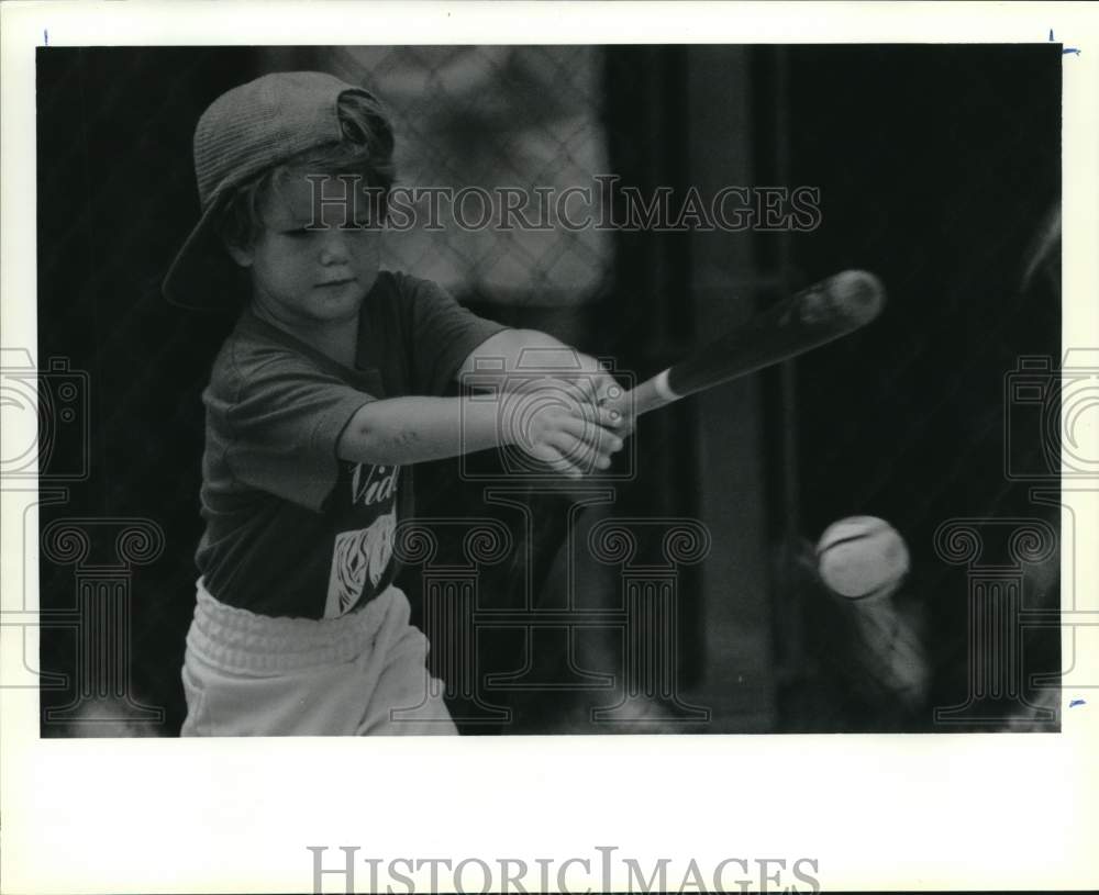 1989 Press Photo T-Ball tournament player, Bubba Whiney, sends ball flying - Historic Images