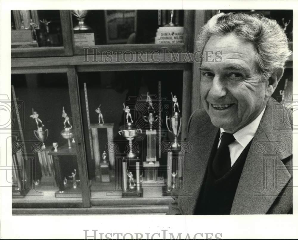 1983 Press Photo Wilfred &quot;Skeeter&quot; Theard poses with the trophies - noc89932 - Historic Images