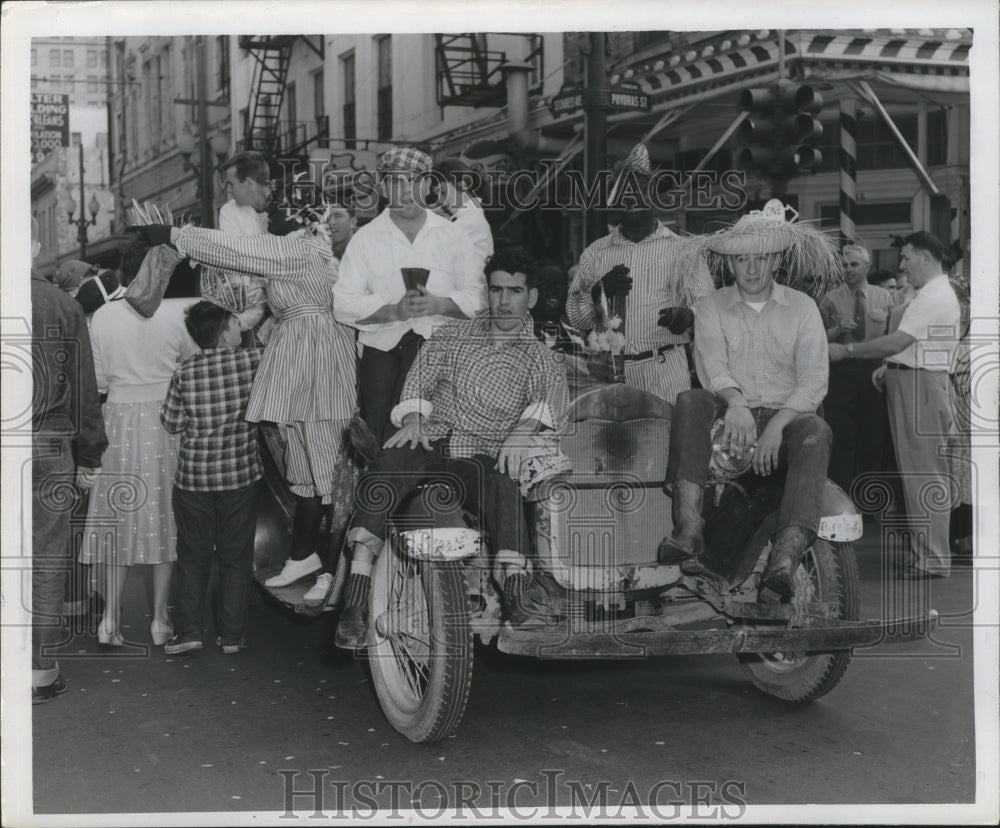 Makers sitting on Car at Mardi Gras, New Orleans  - Historic Images