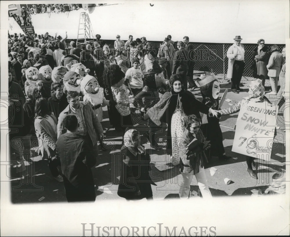 1969 Maskers as Snow White Cast in Procession, Mardi Gras, LA - Historic Images