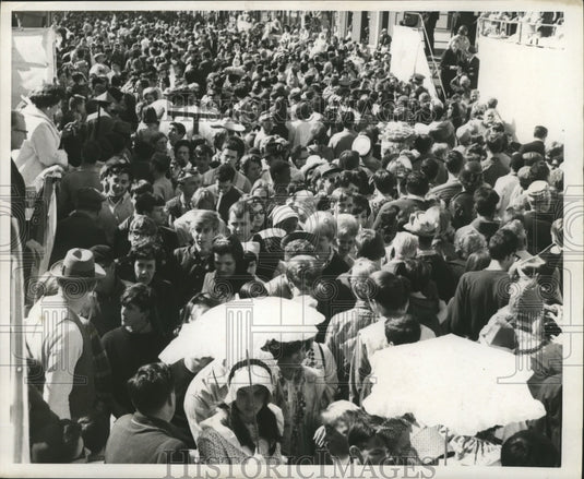 1968 Crowds in costume for Mardi Gras in New Orleans, Louisiana. - Historic Images