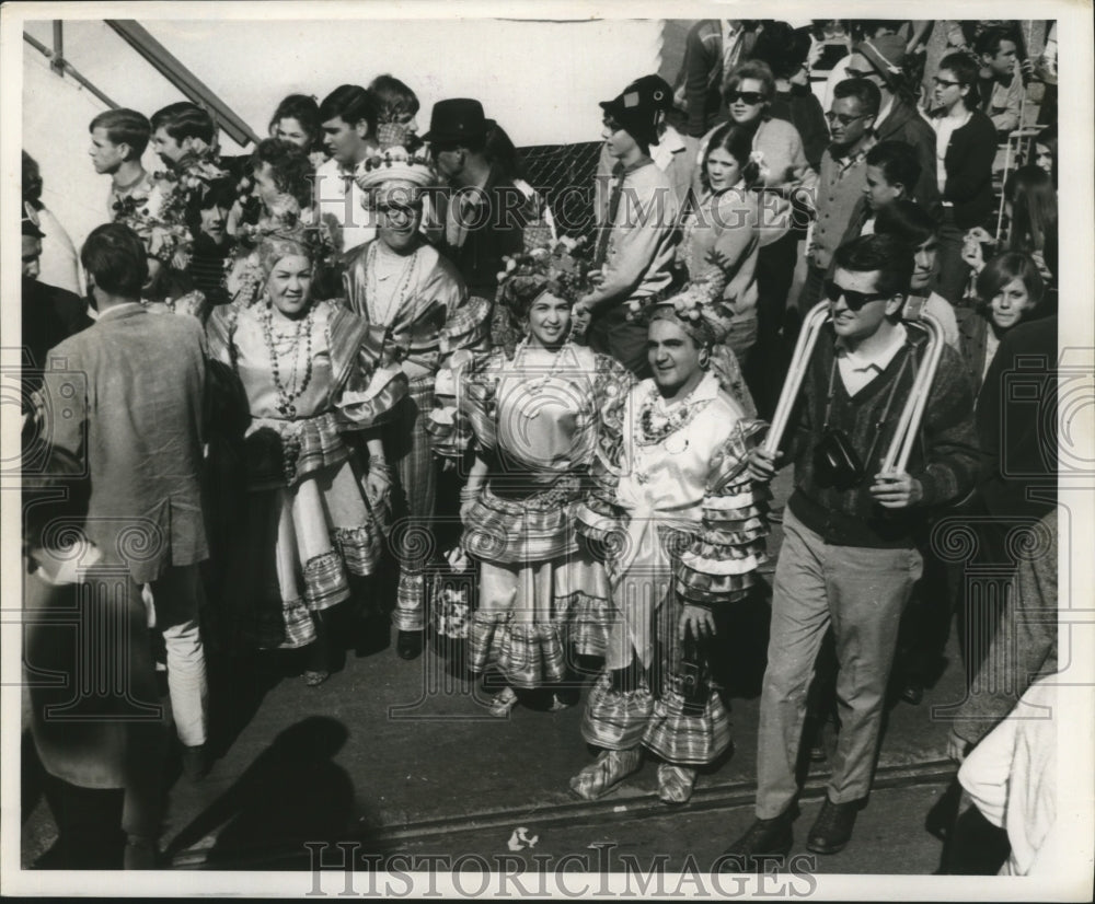 1968 People dress up in unique costumes for Mardi Gras  - Historic Images