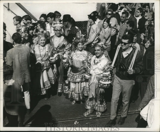 1968 People dress up in unique costumes for Mardi Gras  - Historic Images