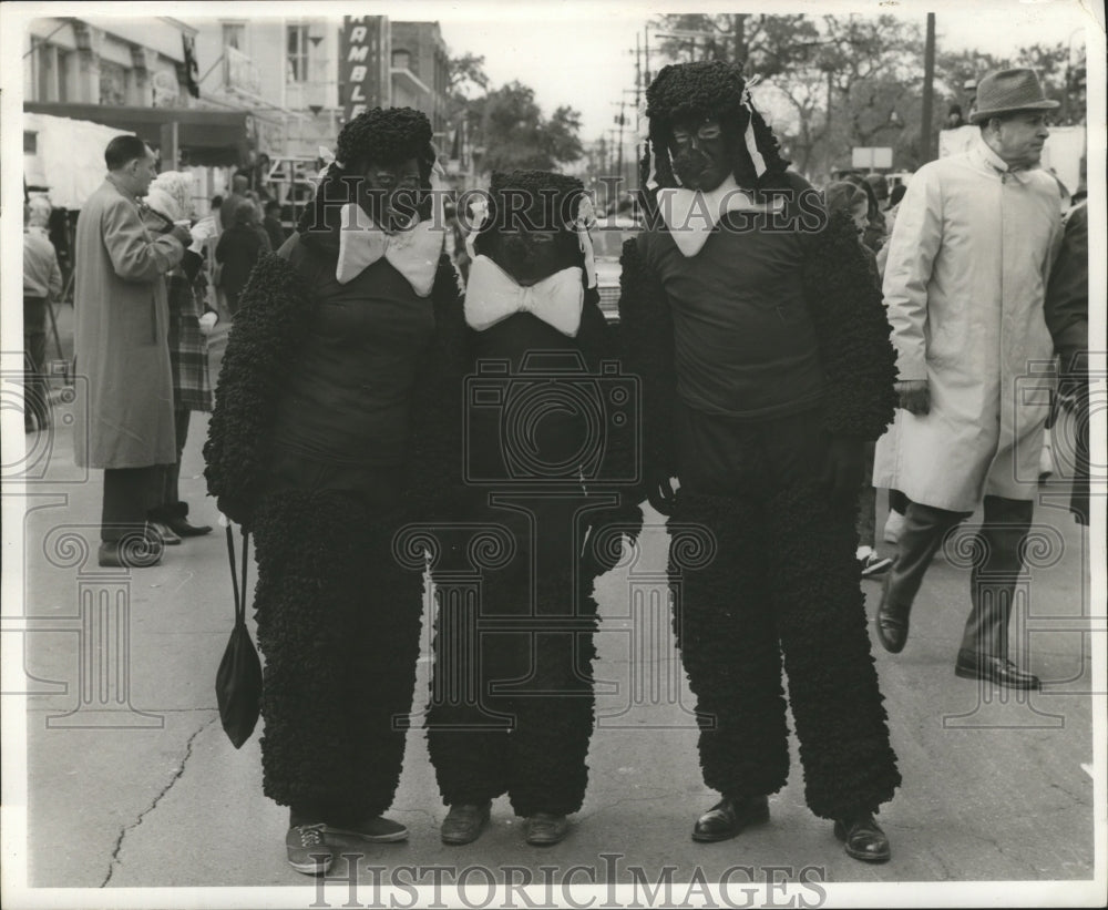 1967 Three people in costume during Mardi Gras in New Orleans - Historic Images