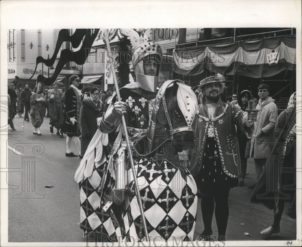 1967 man in knight costume with fake horse at Mardi Gras  - Historic Images