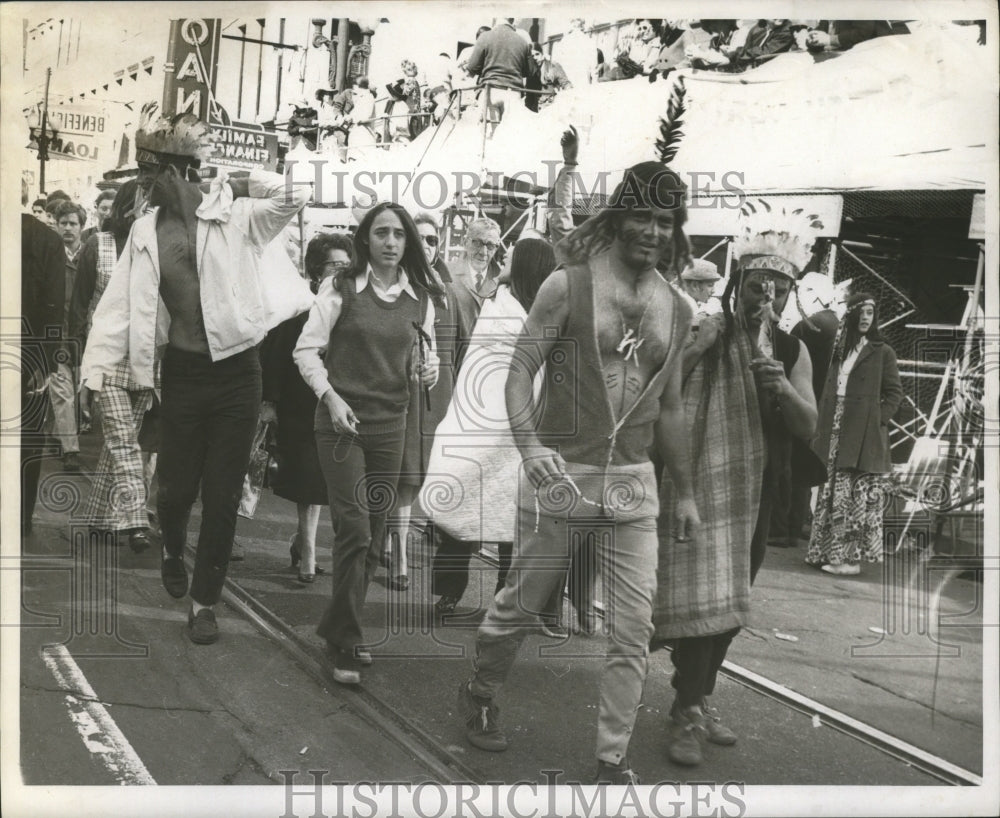 1970 groups walk along New Orleans during Mardi Gras  - Historic Images