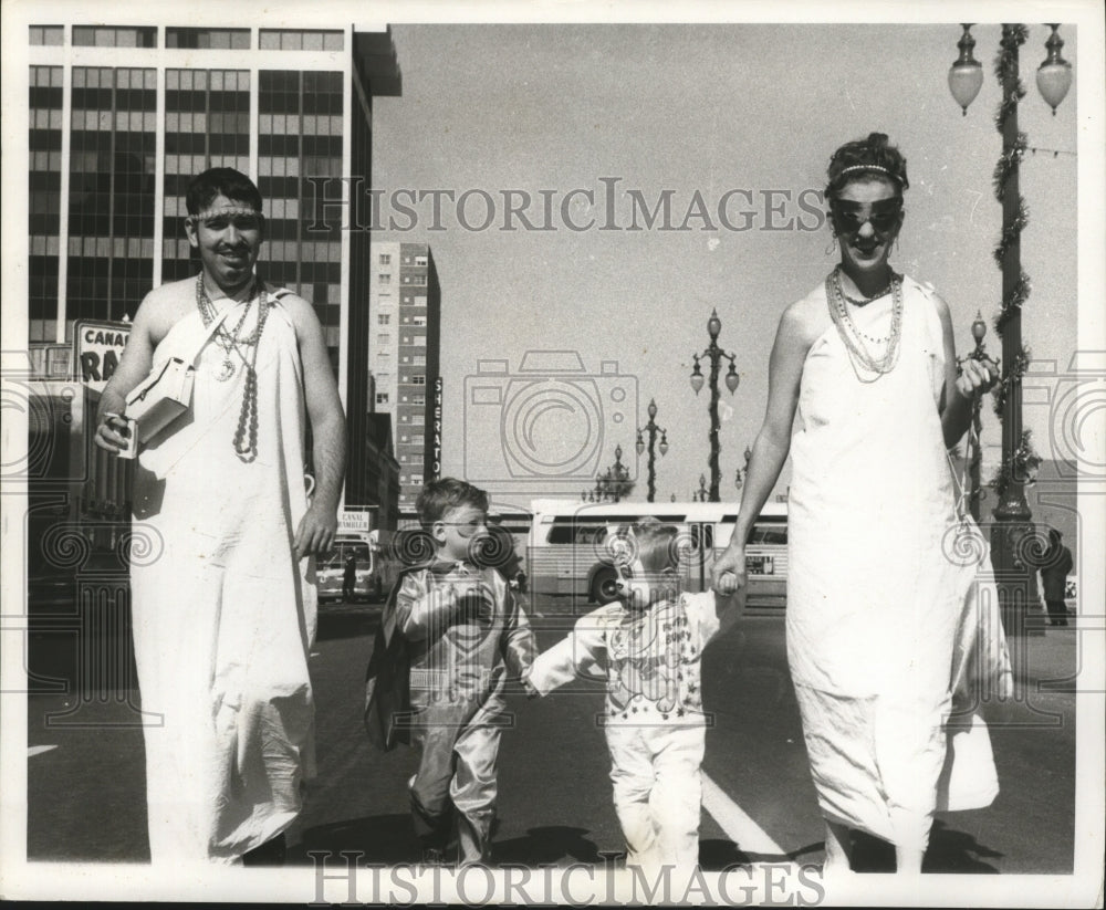 1970 New Orleans Mardi Gras revelers in the street  - Historic Images