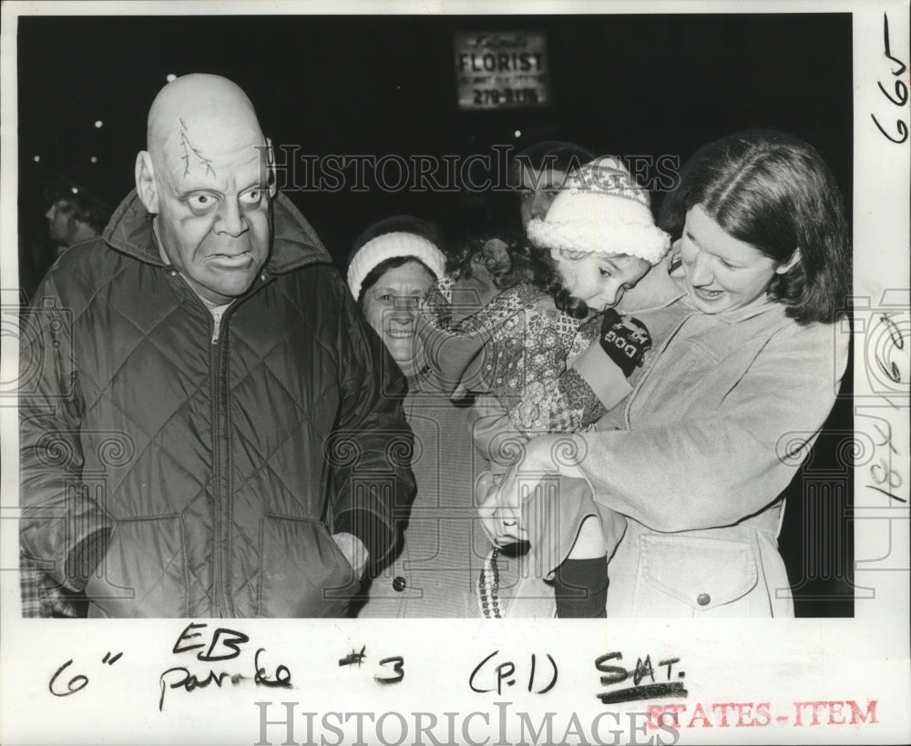 1978 child scared of masked man during Mardi Gras parade  - Historic Images