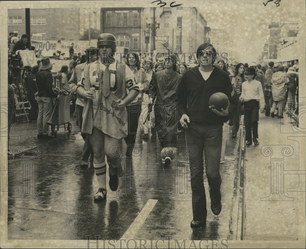 1972 Attendees in Football Attire at the Mardi Gras Parade - Historic Images