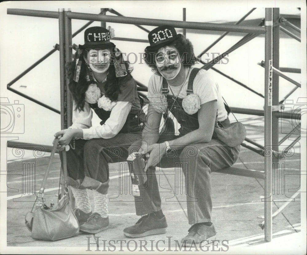 1977 Carnival Masker Taking a Seat at Mardi Gras, New Orleans - Historic Images