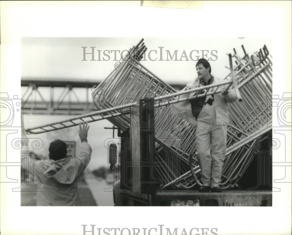 1991 Carnival barricades being set up by Vernon Millett, Gretna. - Historic Images