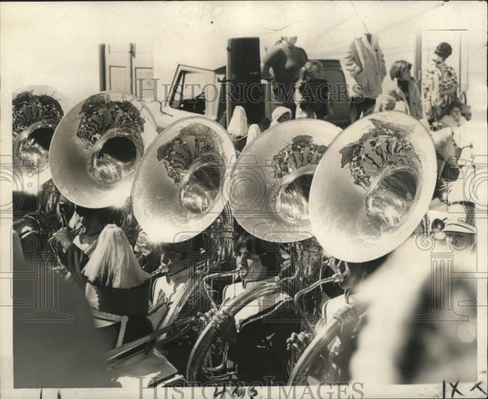 1974 The Tubas reflect what's ahead of these windy band members. - Historic Images