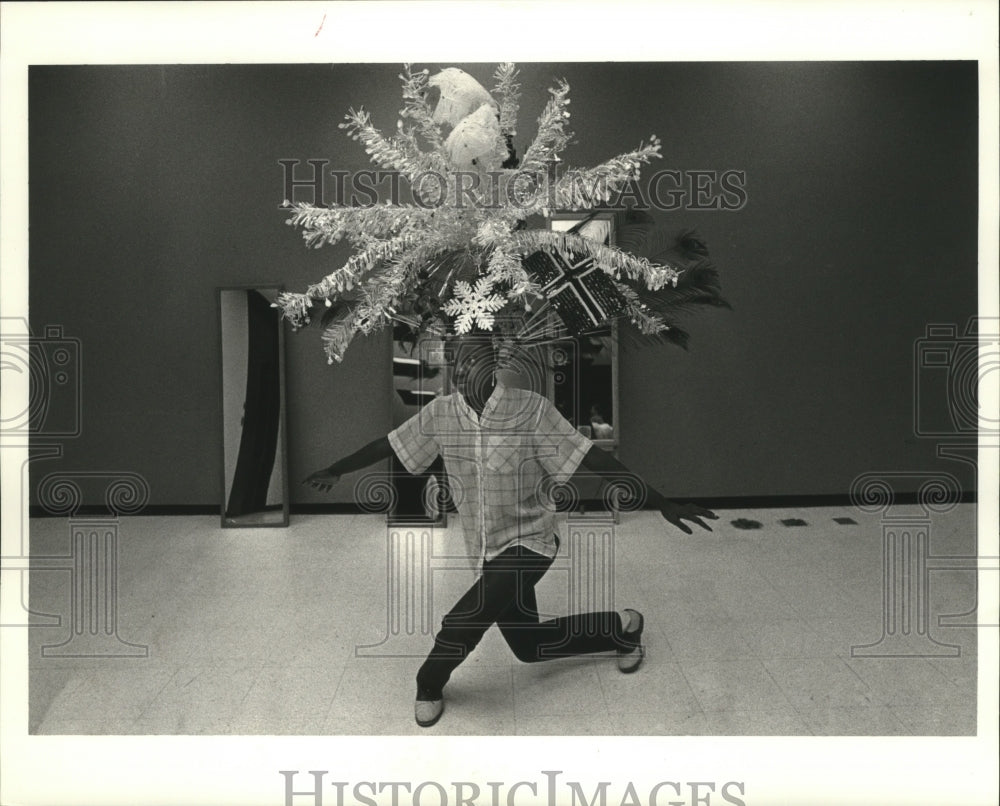 1984 Zulu Member Practices with Head Dress, Mardi Gras, New Orleans - Historic Images