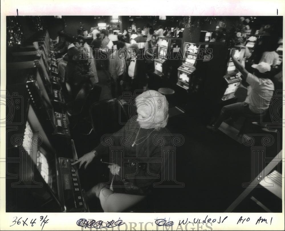 1993 Lucille Locantro plays video poker at the Carnival Club - Historic Images