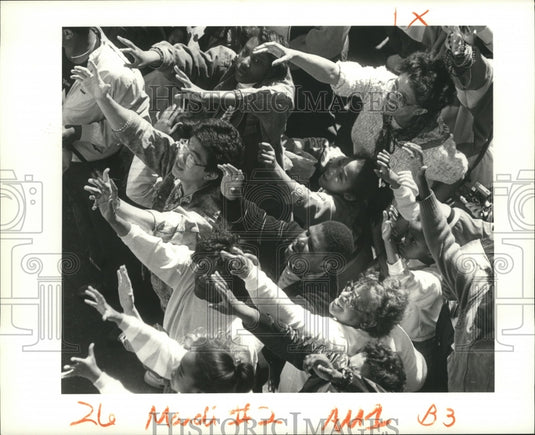 1988 crowd begs for beads on Fat Tuesday on Canal St Mardi Gras - Historic Images