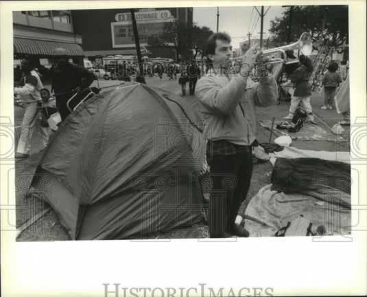1989 David Dean plays "The Saints" in front of his tent  - Historic Images