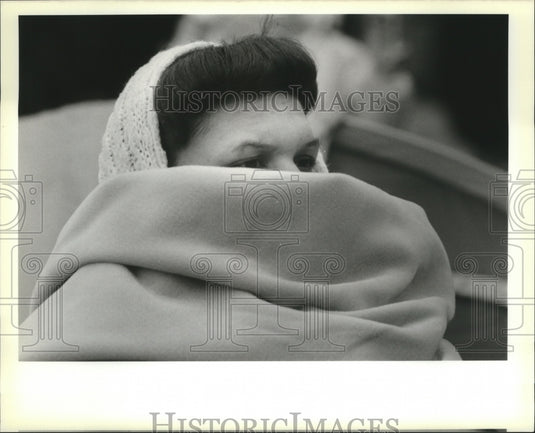 1989 Carmen Jarriet bundles up as she watches Mardi Gras parades - Historic Images