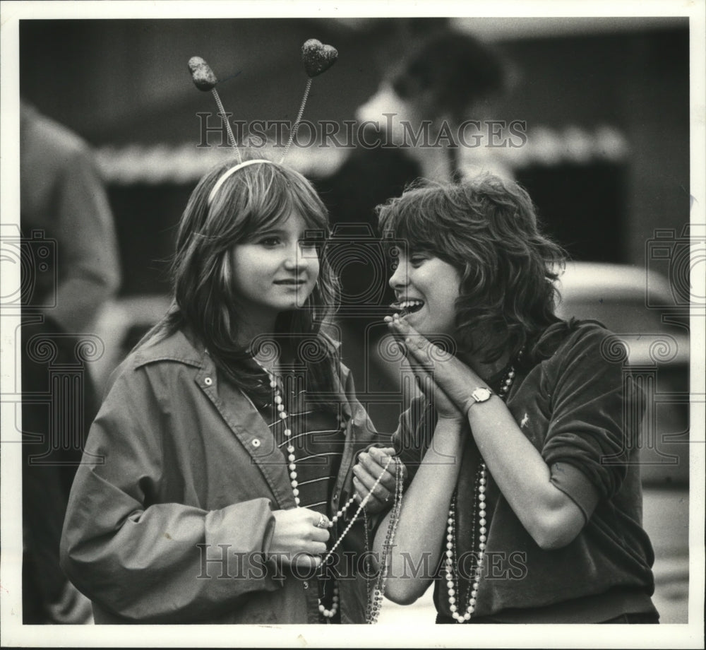 1983 Sheila Blackwell, Ramona Badeaux watch the Krewe of Lul parade - Historic Images