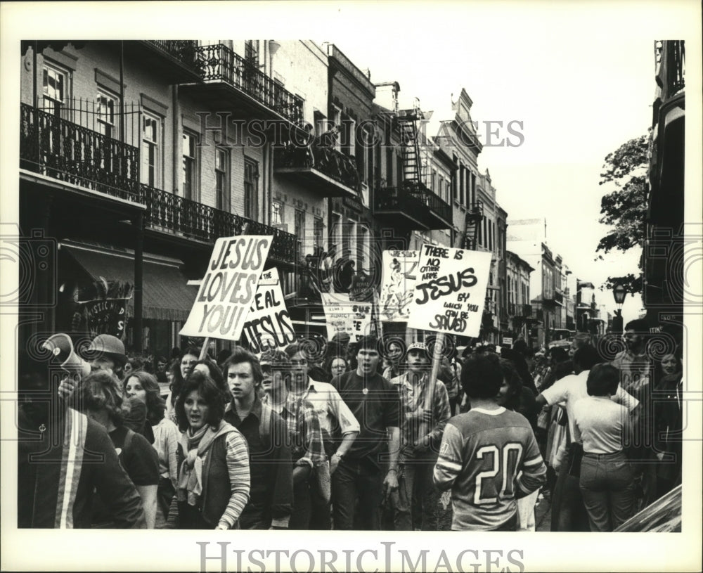 1988 Young People Carrying Jesus Signs at New Orleans Carnival - Historic Images