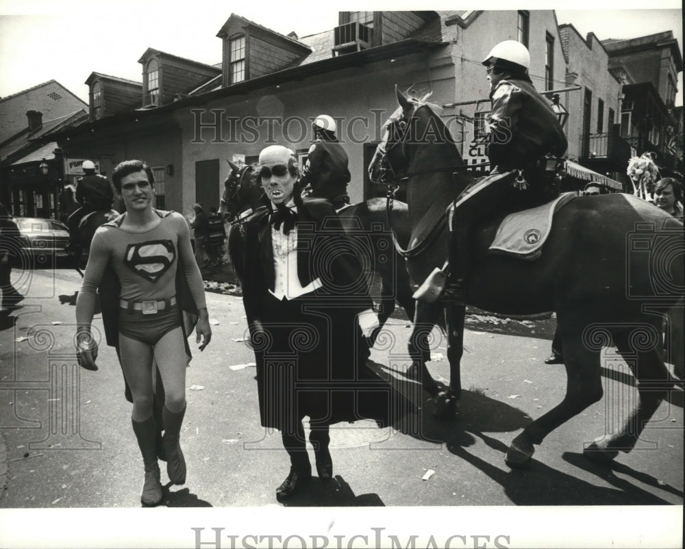 1980 Superman Carnival Masker Walks by Mounted Police in New Orleans - Historic Images