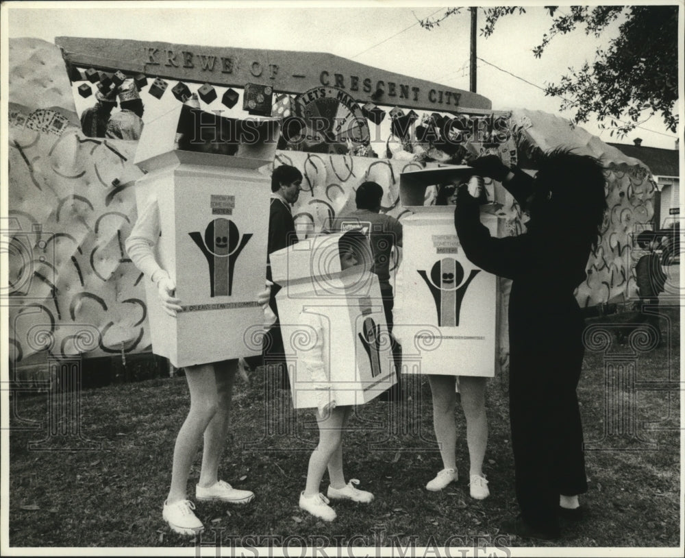 1980 Three Carnival Maskers as Trash Bins at Krewe of Crescent City - Historic Images