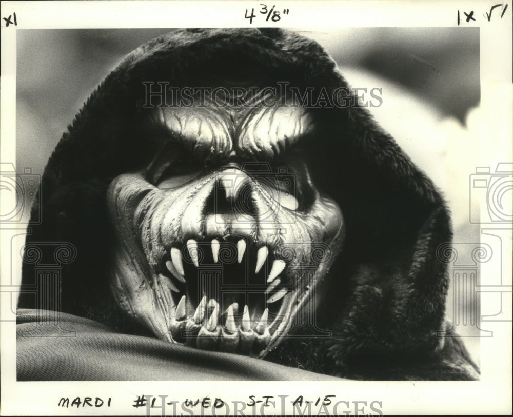 1980 Fearsome Creature Carnival Masker at Mardi Gras Waits for Rex - Historic Images