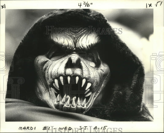 1980 Fearsome Creature Carnival Masker at Mardi Gras Waits for Rex - Historic Images