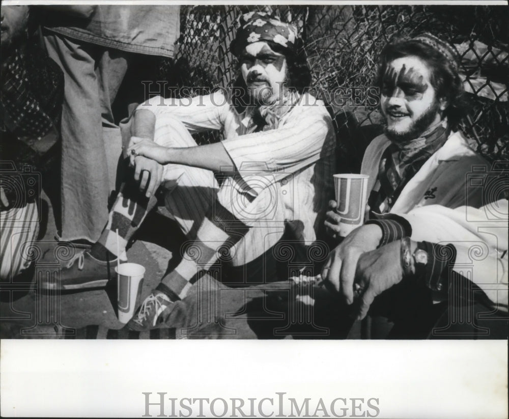 1978 Carnival Maskers with Painted Faces Sitting in New Orleans - Historic Images