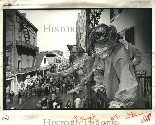 1979 Carnival Masker as Clowns Look Over Bourbon Street New Orleans - Historic Images