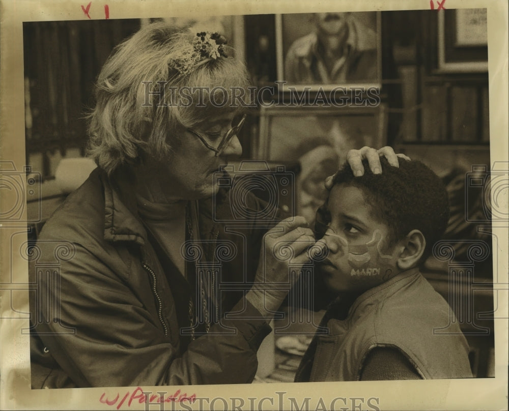 1985 Carnival Maskers preparing for Mardi Gras.  - Historic Images