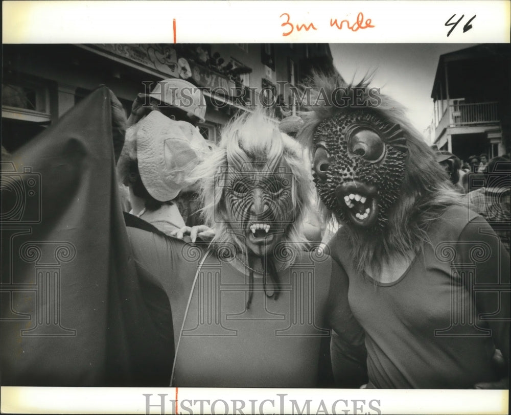 1992 Mardi Gras parade goers in masks at Mardi Gras New Orleans - Historic Images