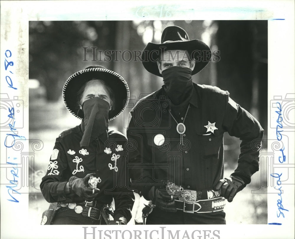 1987 Clara Buras and Wes Kramer handed out cap pistols - Historic Images