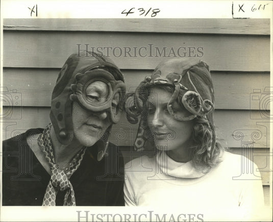 1980 Mary Crawford and tourist model her velvet "Helmet Masks" - Historic Images