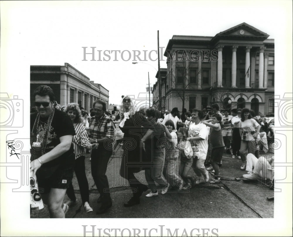 1992 conga line danced at Gretna City Hall awaiting the parades - Historic Images