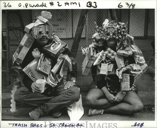 1987 people dressed as trash at St. Charles avenue during Mardi Gras - Historic Images