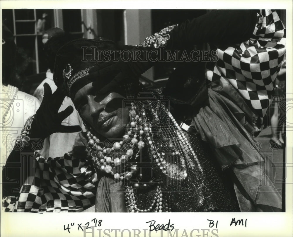 1993 Mardi Gras Jorge Vaseonez with his face painted blue. - Historic Images