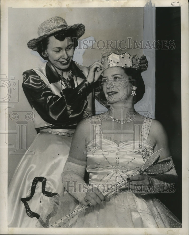 1955 Queen of the Krewe of Neophermenos has her crown adjusted - Historic Images