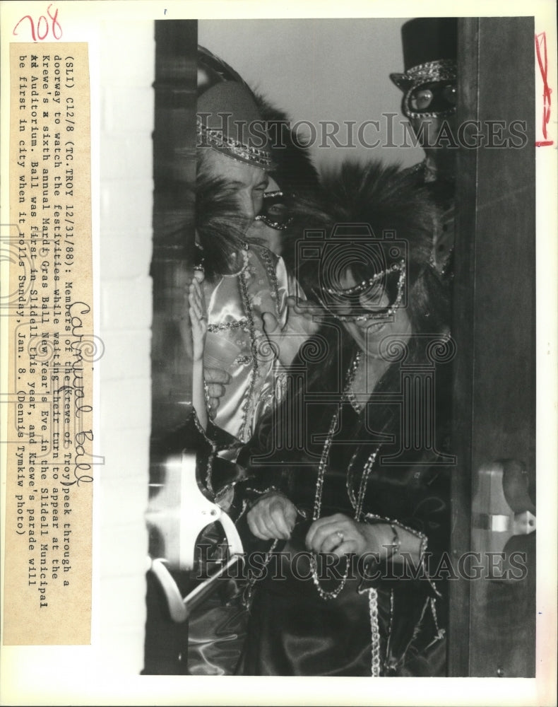 1989 Members of the Krewe of Troy Wait to Appear at Mardi Gras Ball - Historic Images