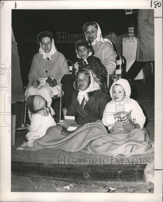 1965 Family Watch Carnival Maskers at Momus Parade in New Orleans - Historic Images