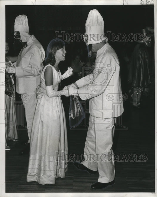 1971 Carnival Revelers Maid Renee Read exclaims "I cant believe it. - Historic Images