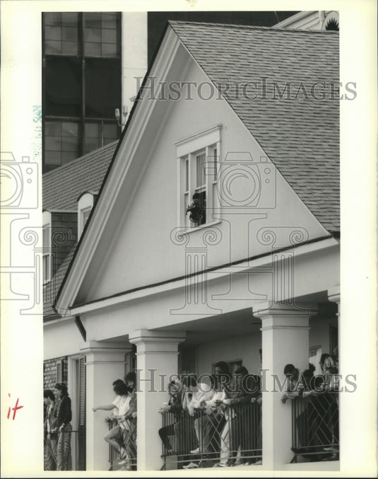 1990 Carnival spectators gather on balconies.  - Historic Images