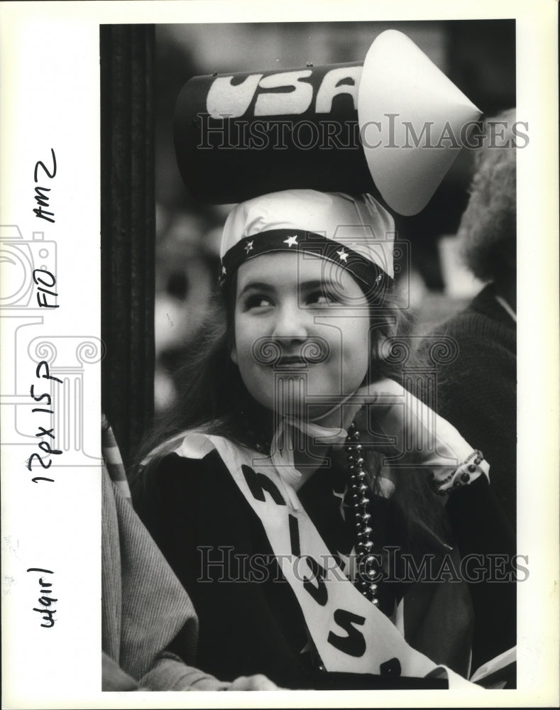 1991 Carnival masker Cammie West of New Orleans waits for Rex. - Historic Images