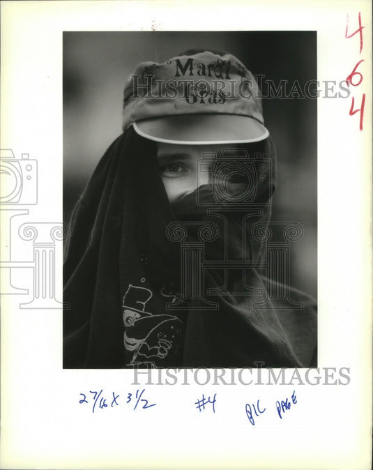 1989 Mike Davis Tries to Stay Warm at Mardi Gras in New Orleans - Historic Images