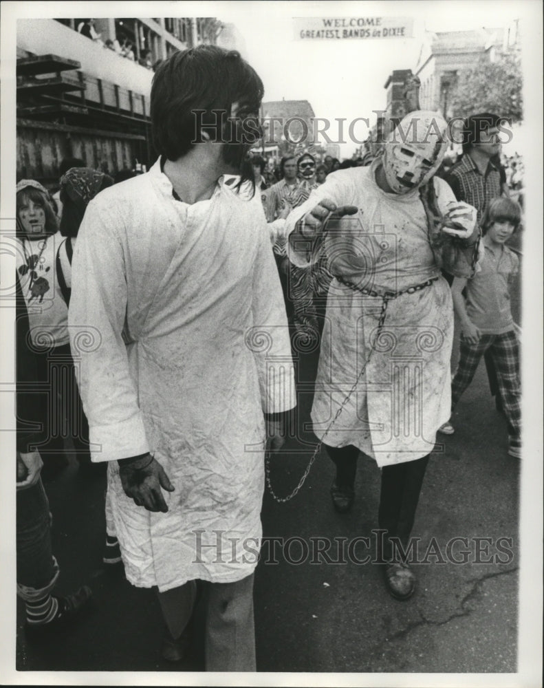 1975 Two Carnival Maskers Chained Together in New Orleans - Historic Images